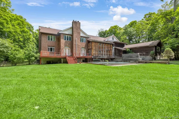 a house view with a sitting space and garden