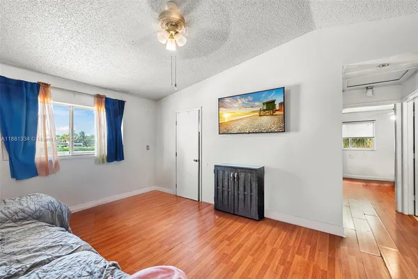 a bedroom with furniture and a window