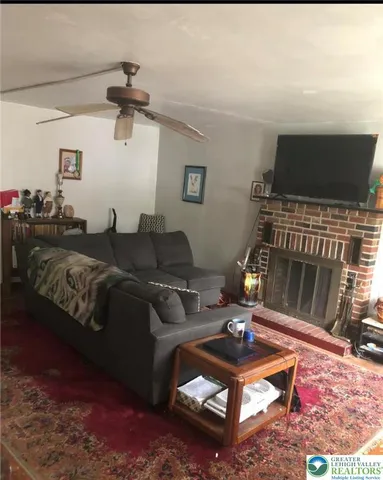 a living room with a couch and a flat screen tv