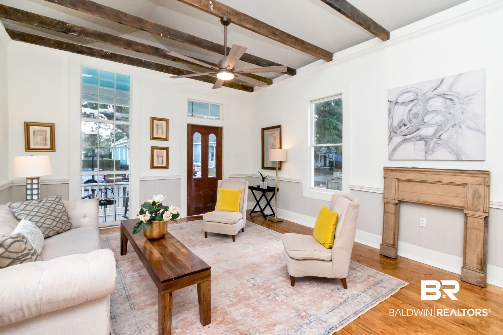 352 Marine Street Mobile, AL 36604 - Photo 2 of 20 Living area featuring a wainscoted wall, beamed ceiling, wood finished floors, and a ceiling fan