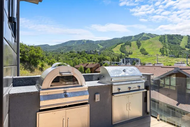 a view of a building with a snow on the road