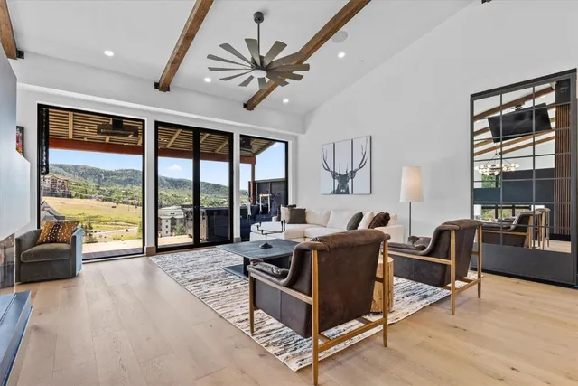 a kitchen with stainless steel appliances kitchen island granite countertop a stove and a refrigerator