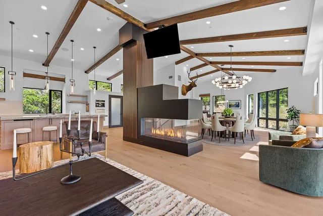 a living room with furniture and a table