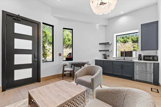 a view of an entryway with wooden floor