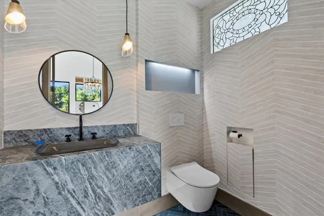 a bathroom with a toilet and a sink