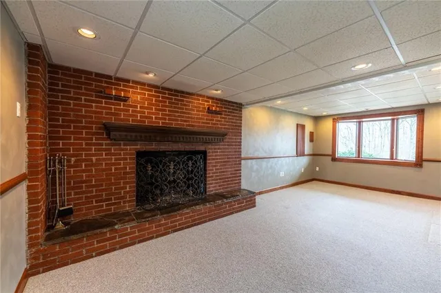 a view of empty room with fireplace