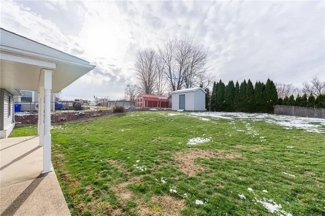a view of a backyard house and porch
