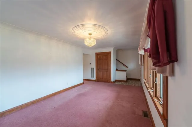 an empty room with a fireplace