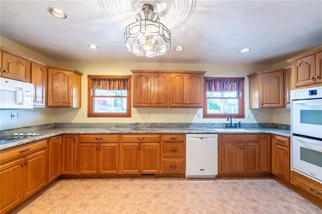 a kitchen with a sink stove and cabinets