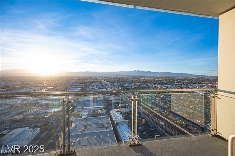 4381 West Flamingo Road, Unit 3303 Las Vegas, NV 89103 - Photo 4 of 37 Balcony featuring a view of city and a mountain view
