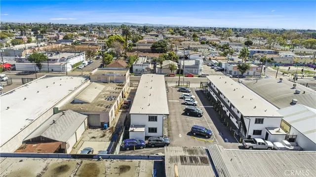an aerial view of a house with a mountain