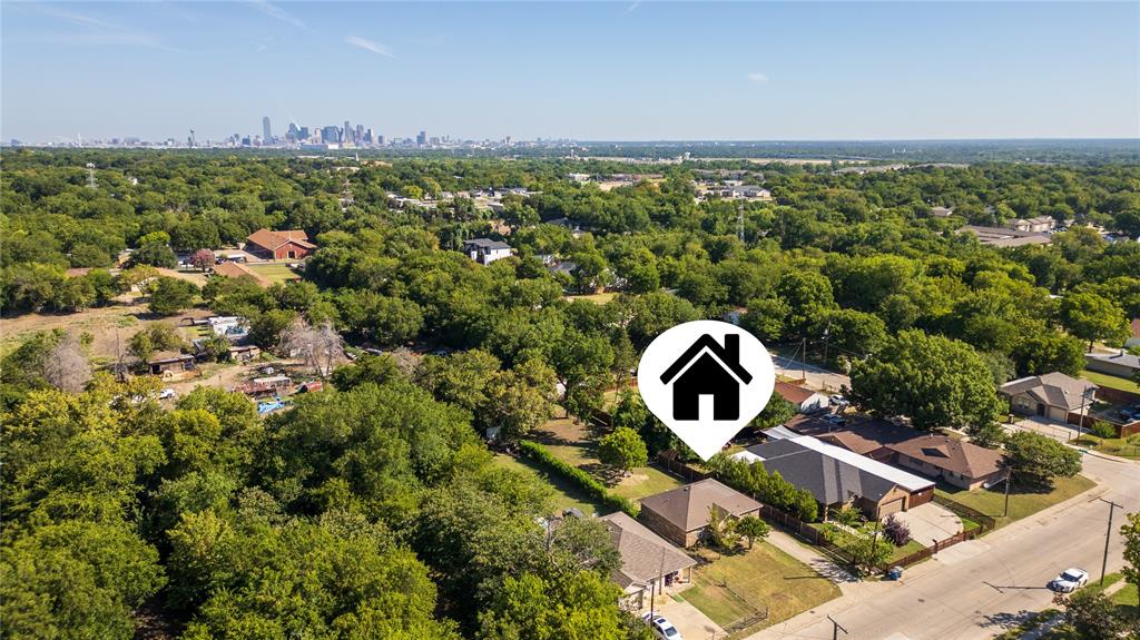 2831 Fordham Road Dallas, TX 75216 - Photo 8 of 8 Aerial perspective showcasing a verdant neighborhood with a distant cityscape
