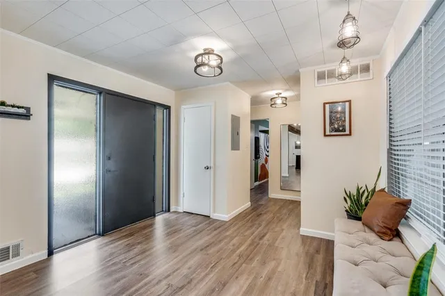 a view of a hallway to a bedroom