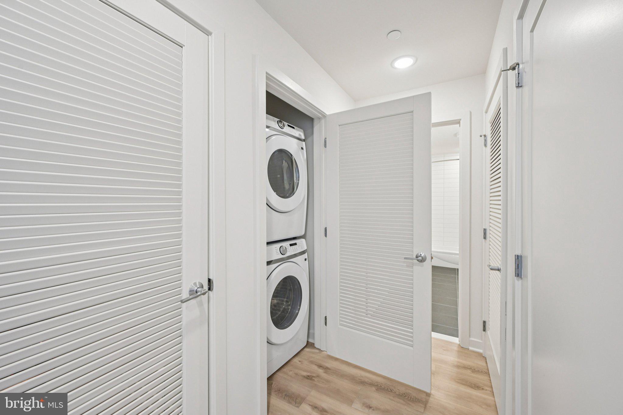 23 Rock Hill Road, Unit 210 Bala Cynwyd, PA 19004 - Photo 6 of 7 a storage room with washer and dryer