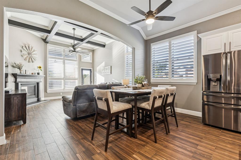 2925 Inn Kitchen Way McKinney, TX 75071 - Photo 13 of 40 a view of a dining room with furniture window and wooden floor