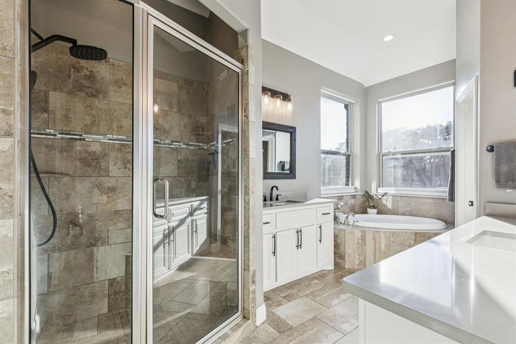 2925 Inn Kitchen Way McKinney, TX 75071 - Photo 16 of 40 a large bathroom with a tub sink shower and mirror