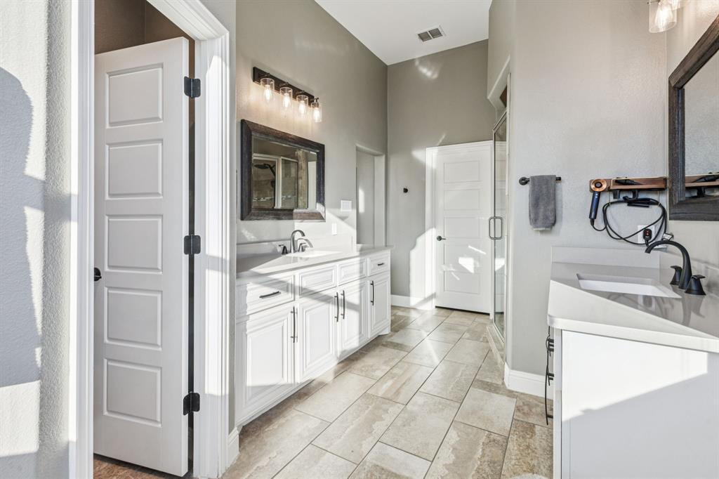 2925 Inn Kitchen Way McKinney, TX 75071 - Photo 17 of 40 a bathroom with a double vanity sink mirror and bathtub