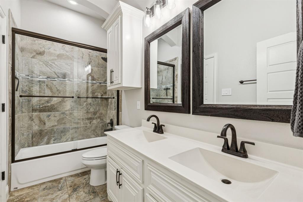 2925 Inn Kitchen Way McKinney, TX 75071 - Photo 19 of 40 a bathroom with a sink and a mirror