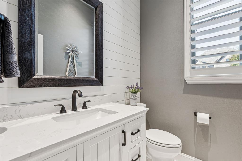 2925 Inn Kitchen Way McKinney, TX 75071 - Photo 21 of 40 a bathroom with a sink a toilet and mirror