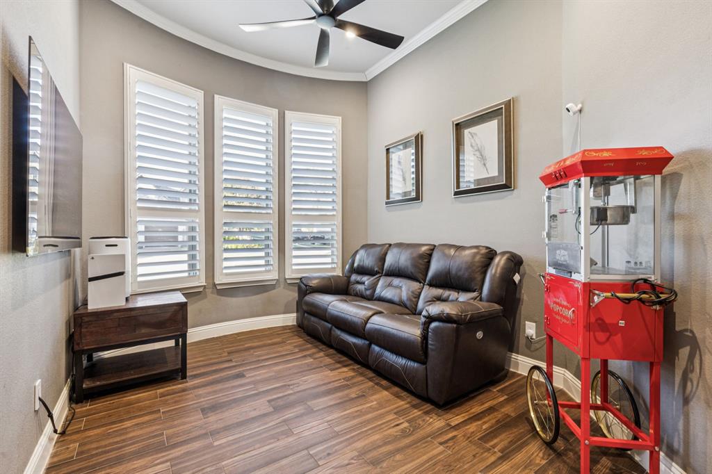 2925 Inn Kitchen Way McKinney, TX 75071 - Photo 23 of 40 a living room with furniture and a wooden floor