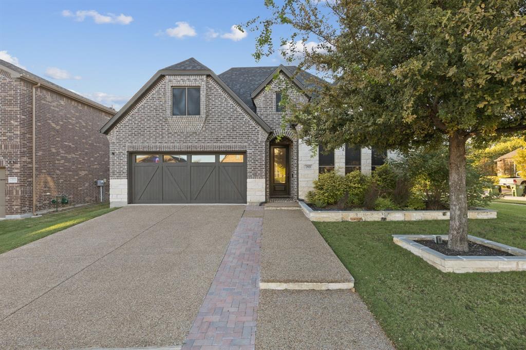 2925 Inn Kitchen Way McKinney, TX 75071 - Photo 27 of 40 a front view of a house with garden