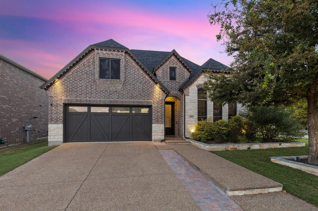 2925 Inn Kitchen Way McKinney, TX 75071 - Photo 4 of 40 a front view of a house with a yard and garage