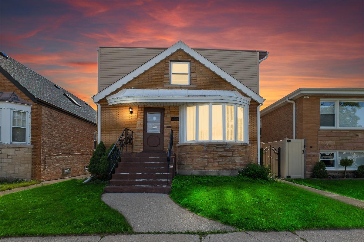 2917 North Neva Avenue Chicago, IL 60634 - Photo 1 of 16 a front view of a house with garden