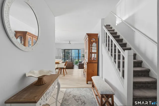 a living room with furniture and a painting