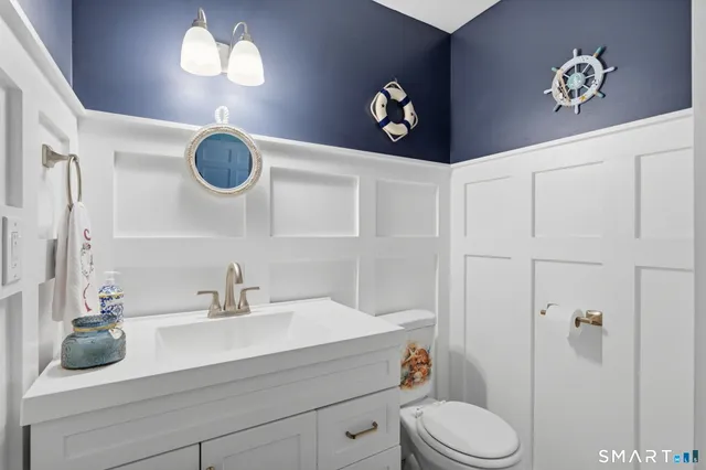 a bathroom with a sink a vanity and a mirror