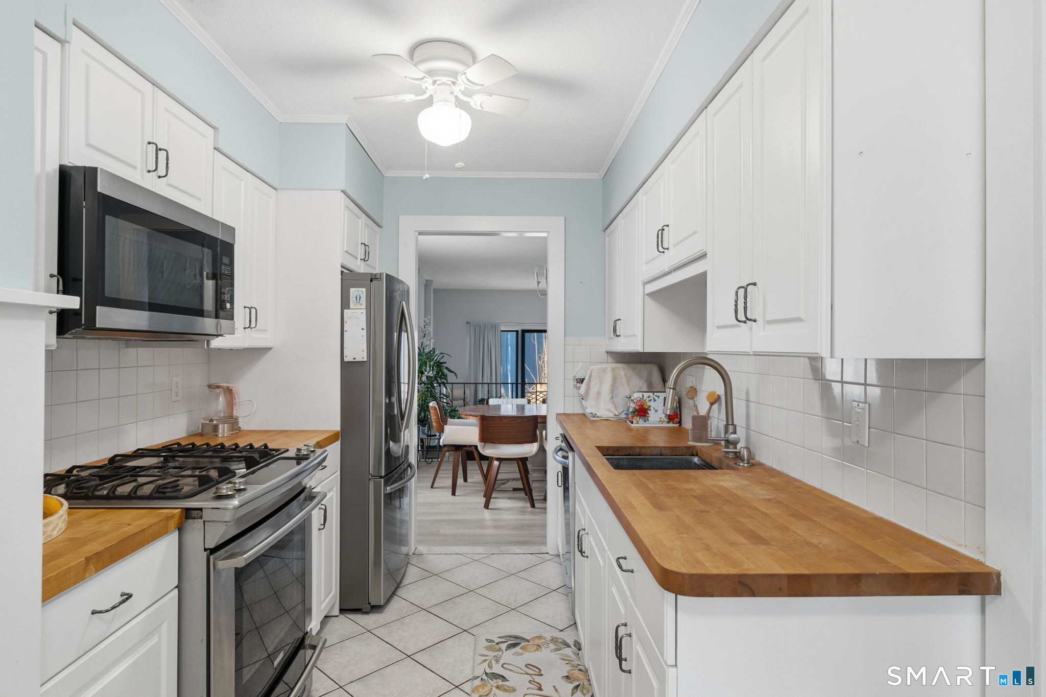 1 Coach Drive, Unit 1 Southington, CT 06489 - Photo 17 of 39 a kitchen with sink stove and cabinets