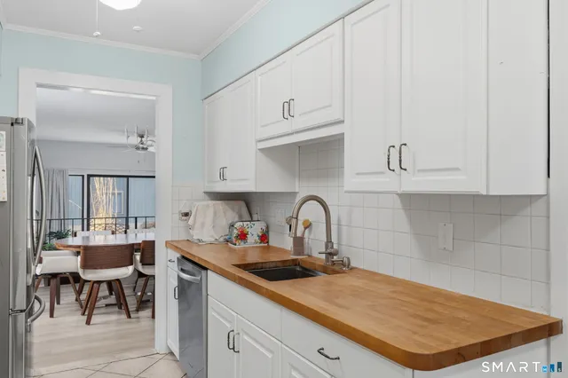 a kitchen with a sink and cabinets