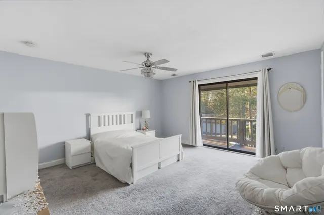 a bedroom with furniture and white walls