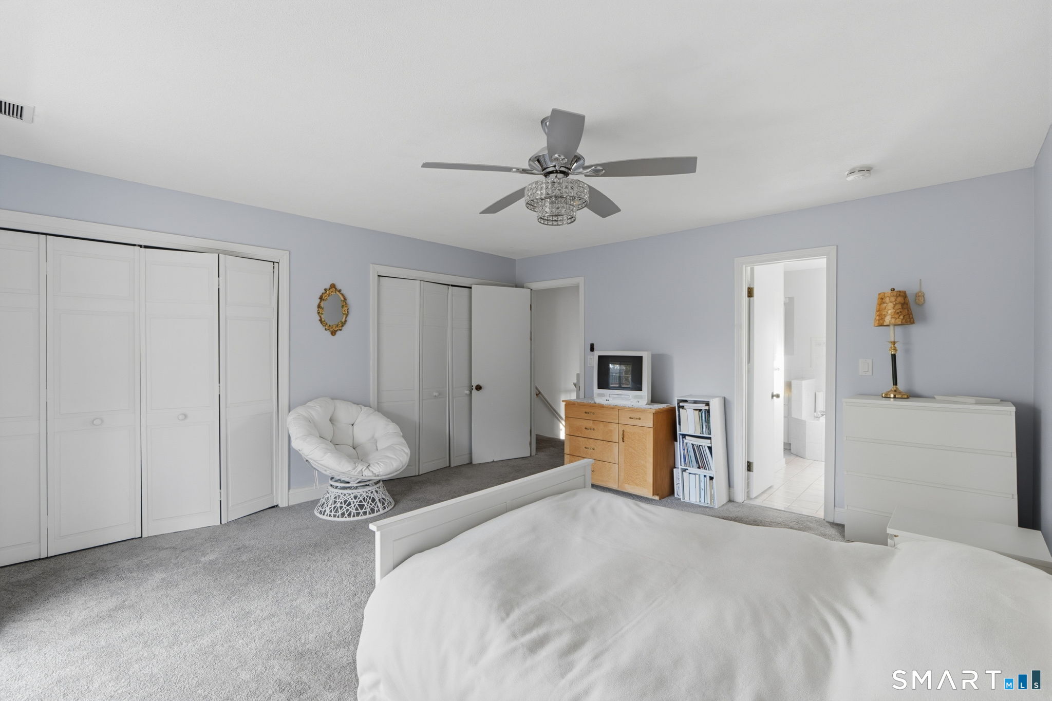 1 Coach Drive, Unit 1 Southington, CT 06489 - Photo 24 of 39 a bedroom with a bed and a chandelier