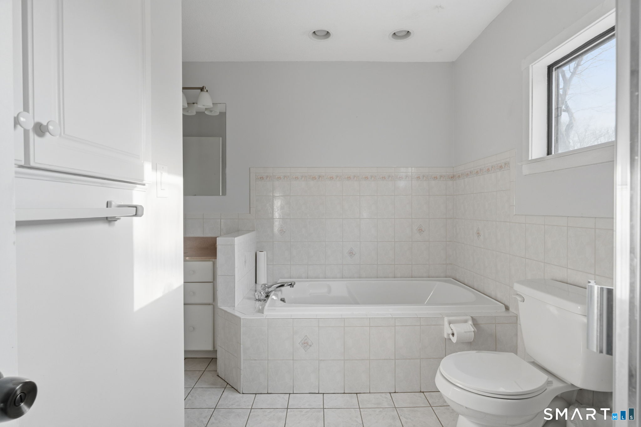 1 Coach Drive, Unit 1 Southington, CT 06489 - Photo 26 of 39 a bathroom with a bathtub and toilet