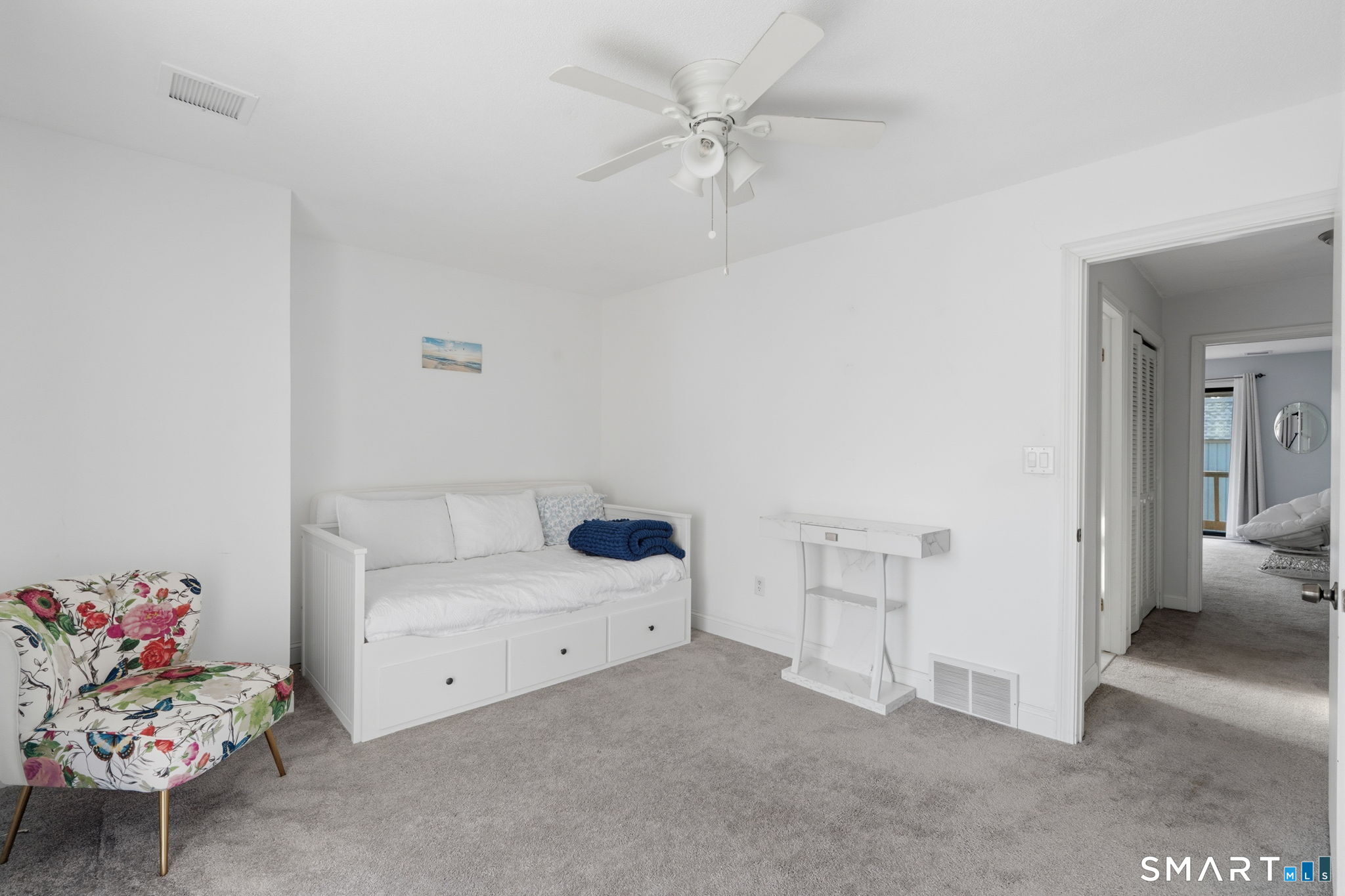 1 Coach Drive, Unit 1 Southington, CT 06489 - Photo 31 of 39 a bedroom with a bed and a chandelier