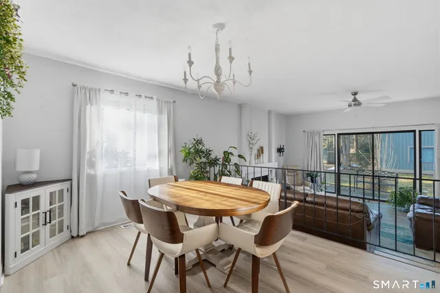 a view of a dining room with furniture window and outside view