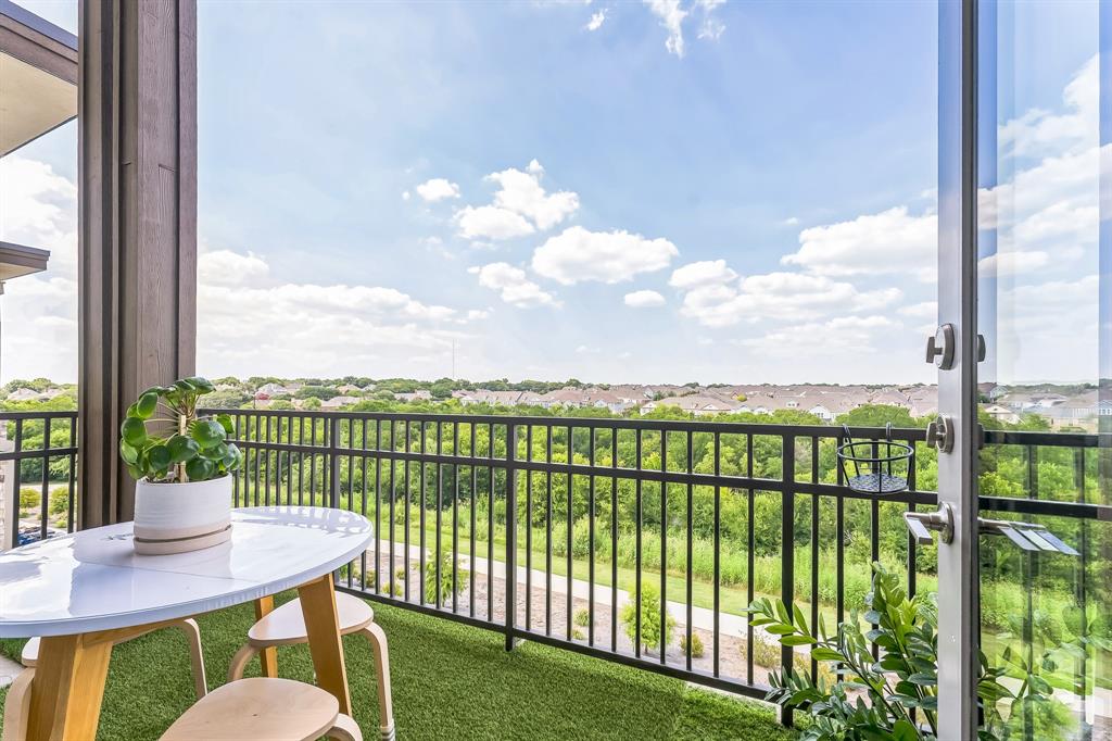 2700 Old Denton Road, Unit 4424 Carrollton, TX 75007 - Photo 1 of 12 a view of a balcony with two chairs and a table