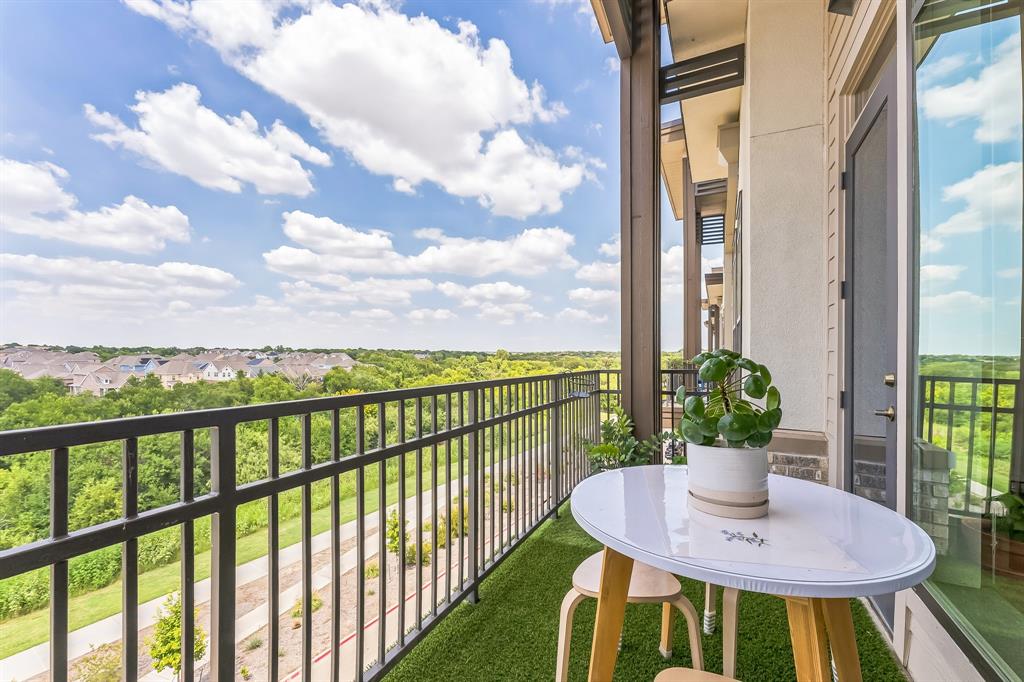 2700 Old Denton Road, Unit 4424 Carrollton, TX 75007 - Photo 12 of 12 a view of a balcony dining table and chairs