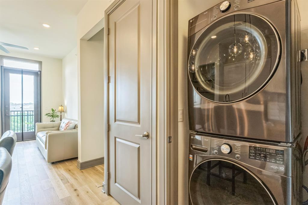 2700 Old Denton Road, Unit 4424 Carrollton, TX 75007 - Photo 5 of 12 a view of a bedroom with washer and dryer