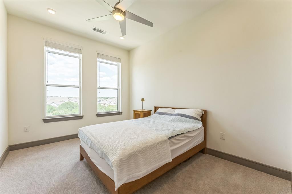 2700 Old Denton Road, Unit 4424 Carrollton, TX 75007 - Photo 8 of 12 a bed sitting in a spacious bedroom next to a window