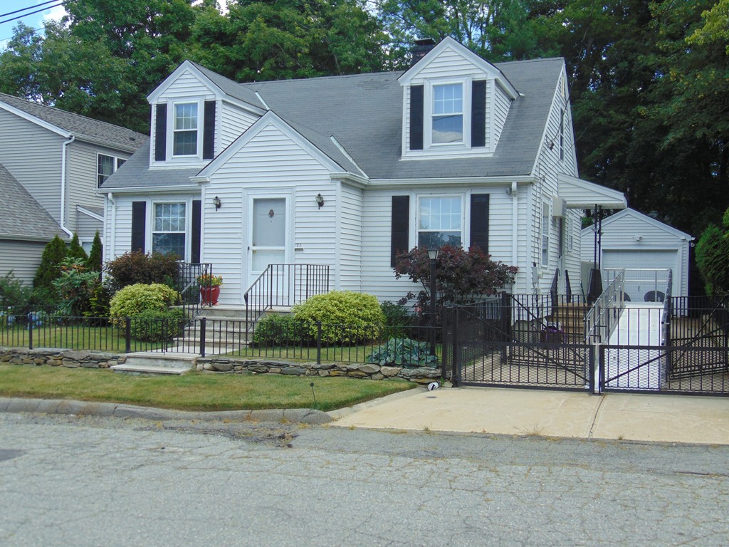 25 O'Hearn Street Fall River, MA 02720 - Photo 1 of 1 a front view of a house with a yard and garage
