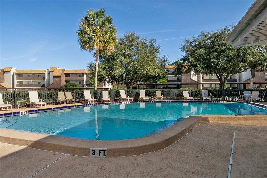 3 Cypress Run, Unit 33A Homosassa, FL 34446 - Photo 45 of 54 a view of a swimming pool with a bench in the patio