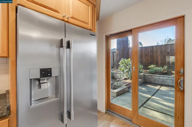 a view of an entryway with wooden floor