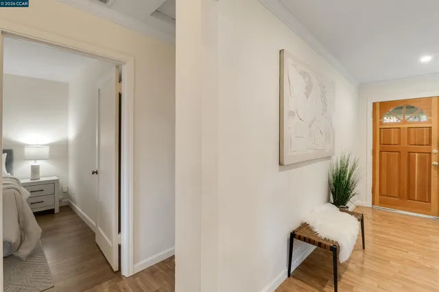 a bedroom with a bed and a potted plant
