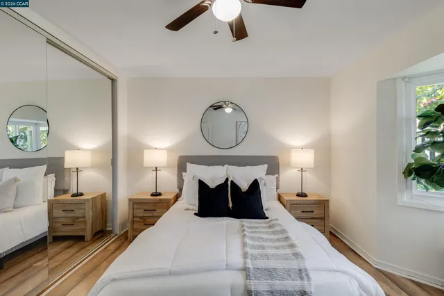 a bedroom with a bed and window