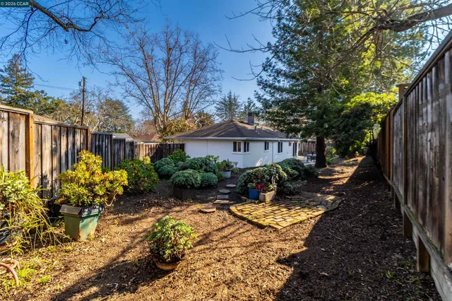 a backyard of a house with lots of green space
