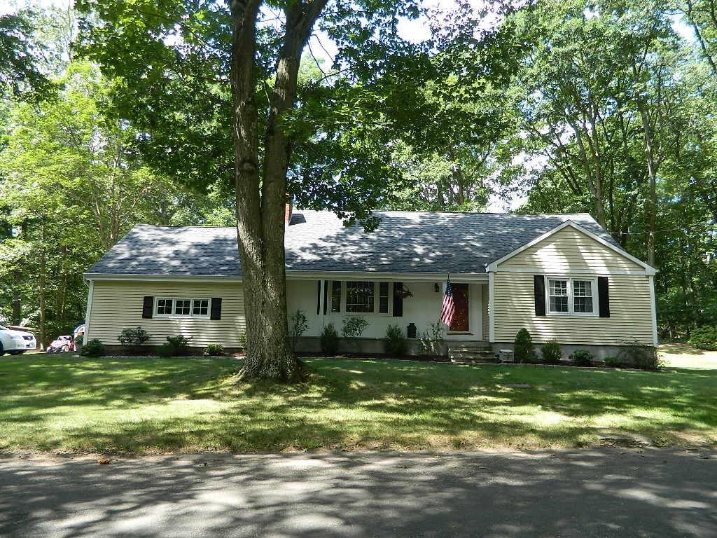 830 Beechwood Road Orange, CT 06477 - Photo 1 of 1 a front view of house with yard