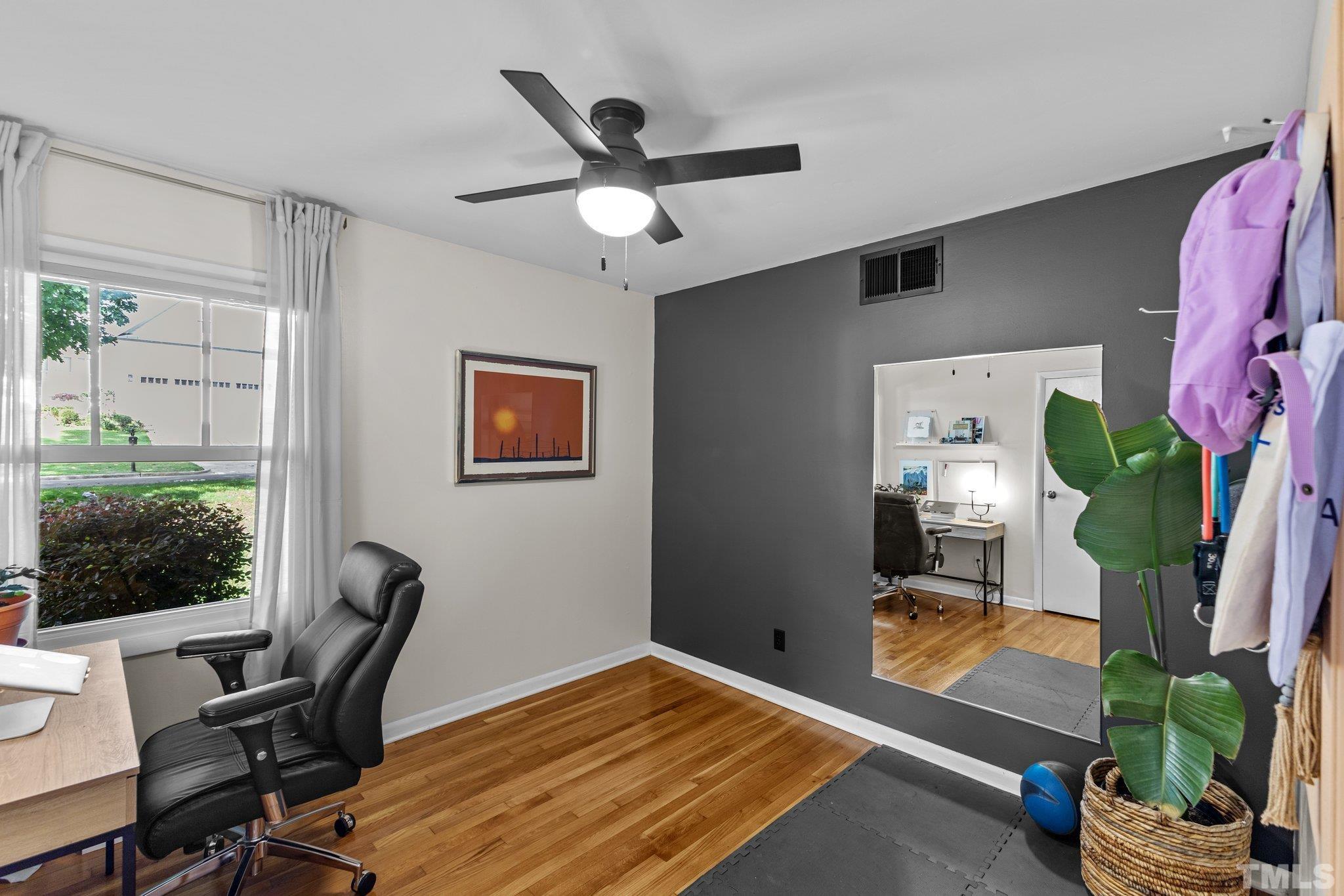 4912 Latimer Road Raleigh, NC 27609 - Photo 22 of 35 a workspace with furniture window and wooden floor