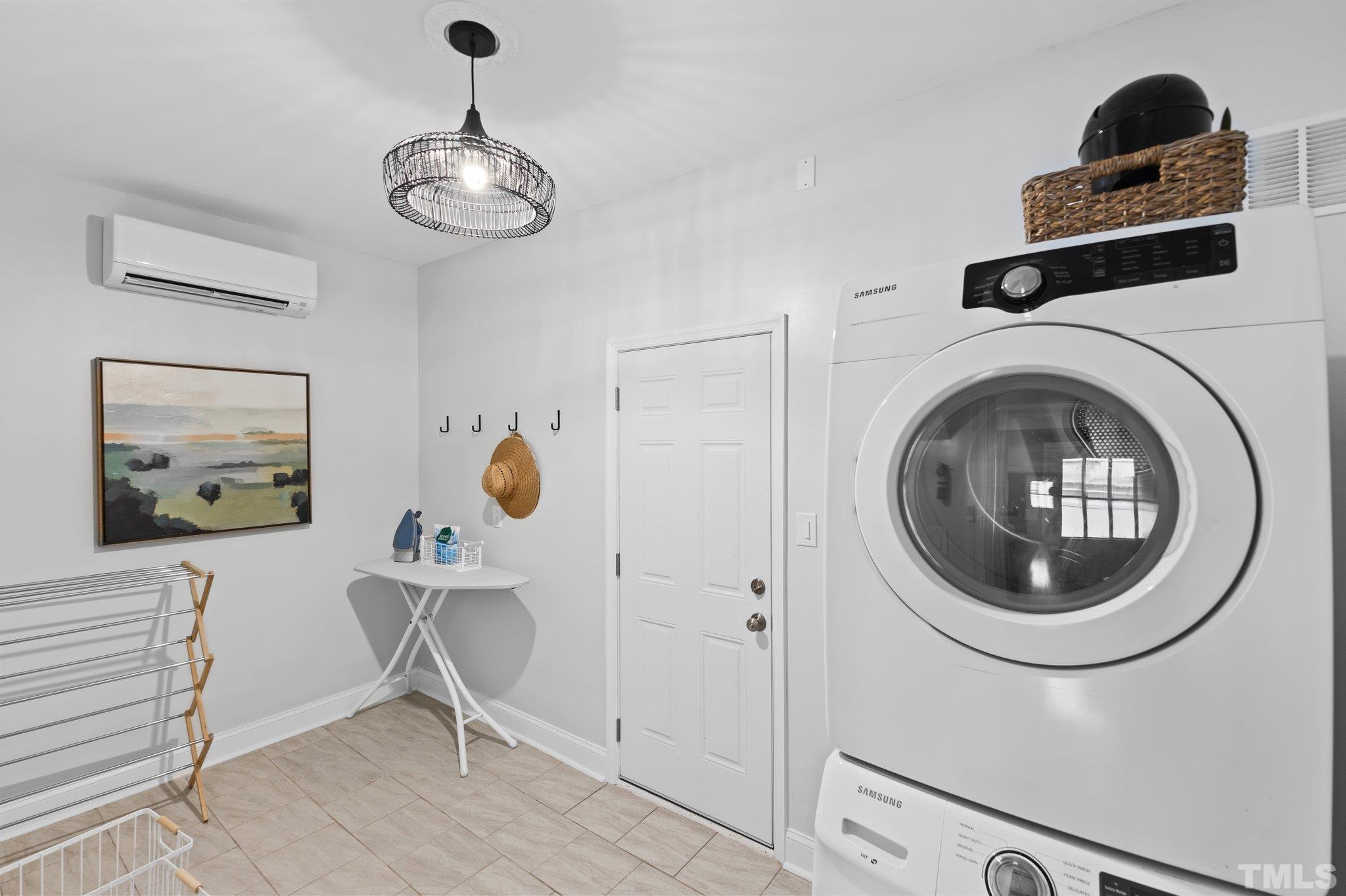 4912 Latimer Road Raleigh, NC 27609 - Photo 27 of 35 a view of a hallway with washer and dryer