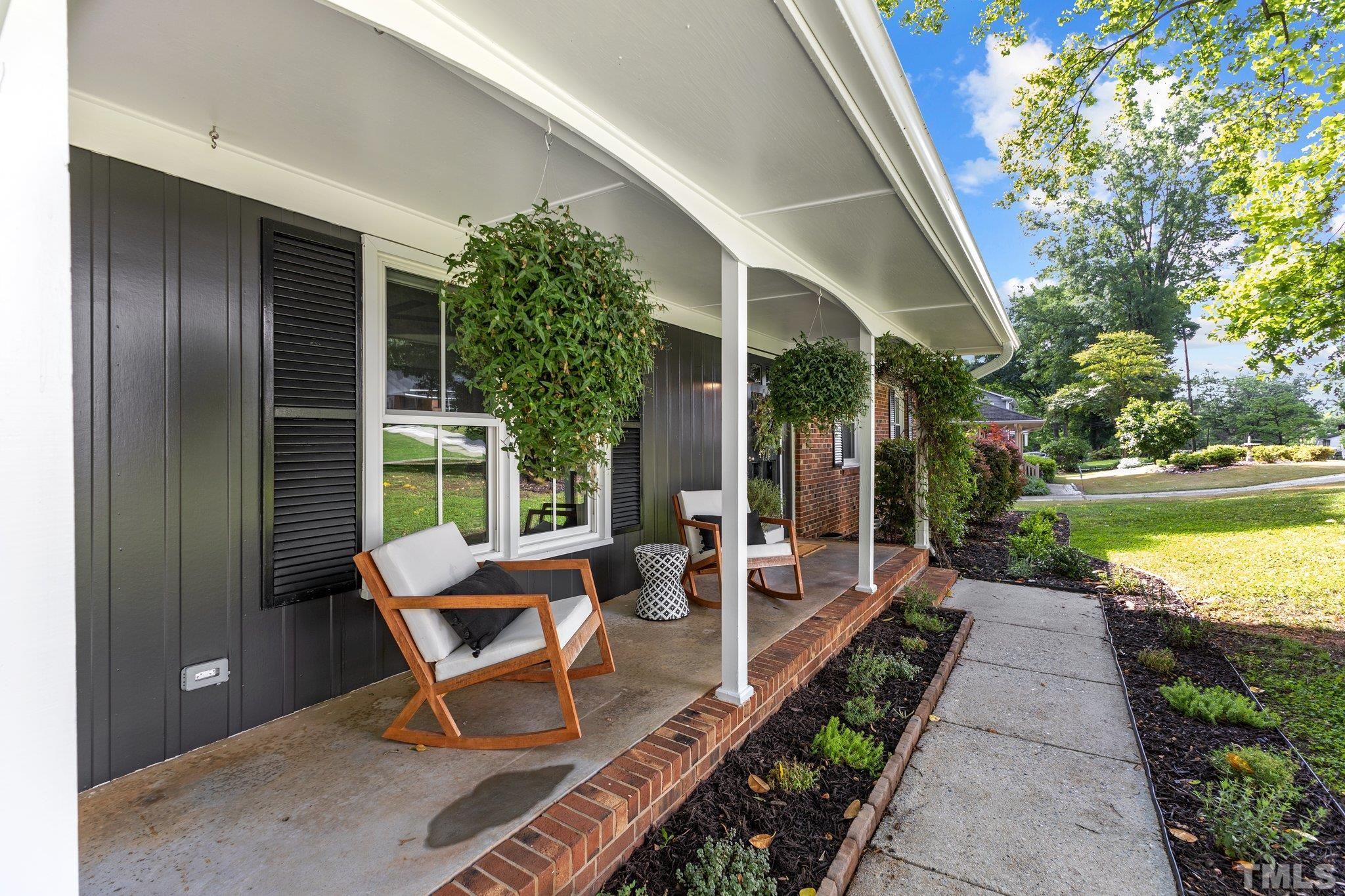4912 Latimer Road Raleigh, NC 27609 - Photo 3 of 35 a building outdoor space with patio furniture and garden